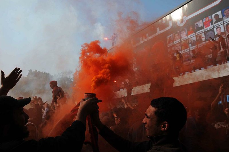 Fans of a Cairo soccer team celebrate Saturday after 21 fans of a rival team in Port Said, Egypt, were sentenced to death for their roles in a brawl last year that killed 74 people and injured more than 1,000. 