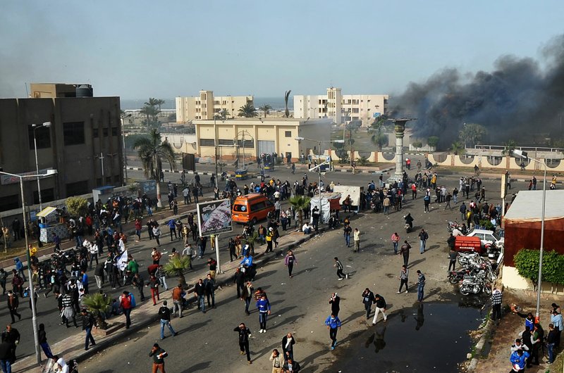 Egyptian protesters clash with police, unseen, in Port Said, Egypt, Sunday, Jan. 27, 2013. Violence erupted briefly when some in the crowd fired guns and police responded with volleys of tear gas, witnesses said. State television reported 110 were injured. Egyptian health officials say 3 have been killed in clashes between protesters and police in Port Said.