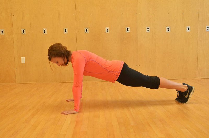 For basic push-ups, don’t lift your head to look forward: Keep your neck neutral and your hands beneath your shoulders. In the plank position, press down and up, bending and straightening your elbows. 