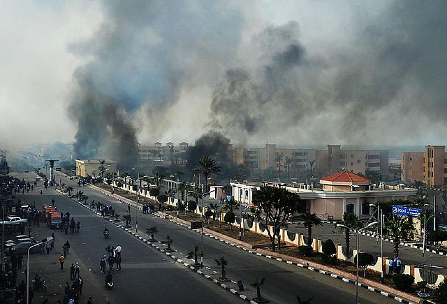 Smoke rises after Egyptian protesters clash with police in Port Said, Egypt, on Sunday. 