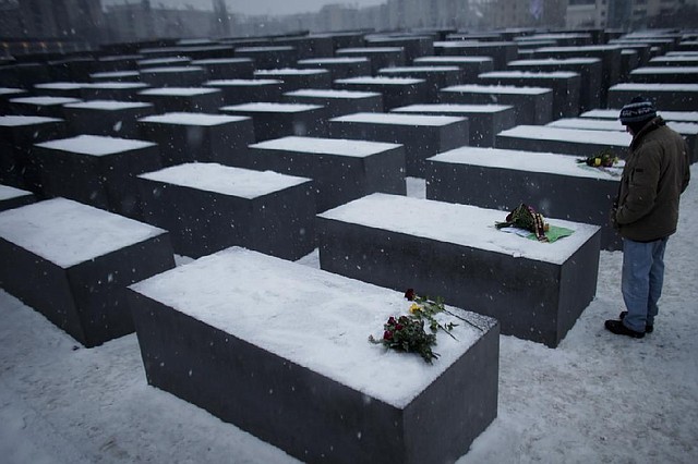 A man visits the Holocaust Memorial in Berlin on Sunday to commemorate the victims of the Nazi regime on International Holocaust Remembrance Day, which marks the liberation in Poland of the Auschwitz death camp on Jan. 27, 1945.