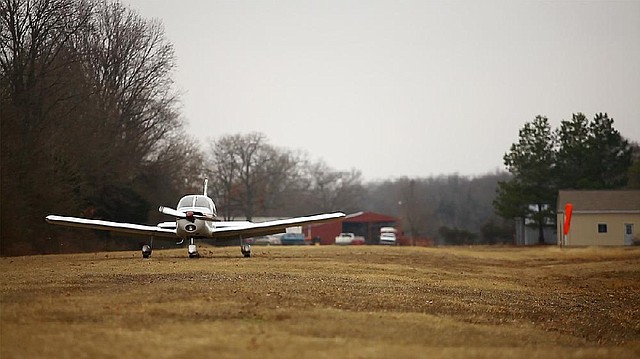 Arkansas Democrat-Gazette/RYAN MCGEENEY --01-25-2013-- Bob Shingledecker of Altus lands his 150-horsepower Piper Cherokee at Winfield Airpark, a privately-owned aviation community located about five miles south of Altus. The airport, which features a 2,600-foot-long runway of Bermuda grass, is one of more than 200 privately-owned airports in Arkansas.