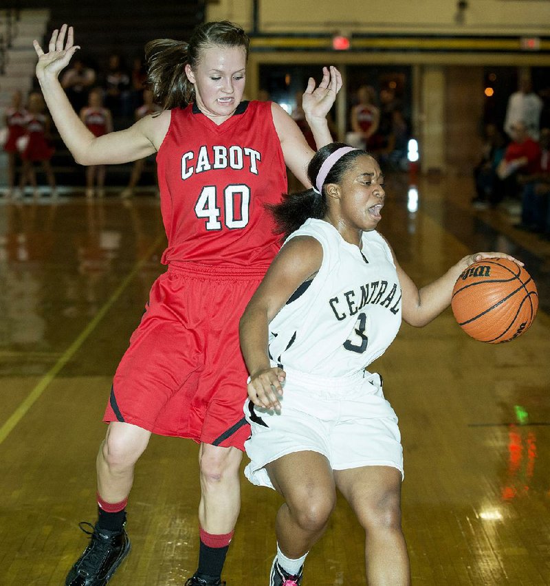 Central's Taylor Lewis (4) tries to outrun Cabot's Taylor Elliot (40) during the Cabot v. Central game held Tuesday night at Central High School.