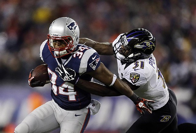 Baltimore Ravens strong safety Bernard Pollard (31) tackles New England Patriots running back Shane Vereen (34) during the first half of the NFL football AFC Championship football game in Foxborough, Mass., Sunday, Jan. 20, 2013. (AP Photo/Steven Senne)