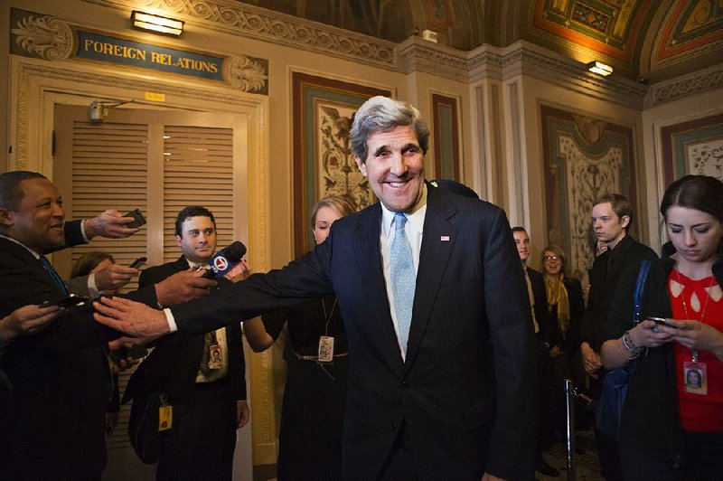 Sen. John Kerry, D-Mass., emerges after a unanimous vote by the Senate Foreign Relations Committee approving him to become America's next top diplomat, replacing Secretary of State Hillary Rodham Clinton, on Capitol Hill in Washington, Tuesday, Jan. 29, 2013. Kerry, who has served on the Foreign Relations panel for 28 years and led the committee for the past four, is expected to be swiftly confirmed by the whole Senate later Tuesday.   (AP Photo/J. Scott Applewhite)