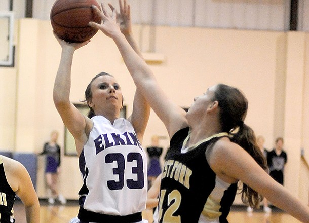STAFF PHOTO ANTHONY REYES -- Elkins sophomore Alleigh Stahman (33) shoots as West Fork junior Katie Griffin defends in the first half Tuesday, Jan. 29, 2013 in Elkins. 