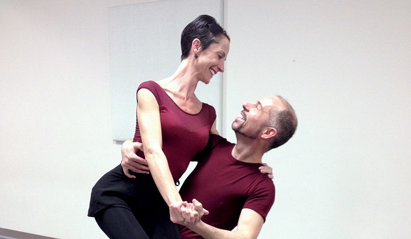 Carrie Dicken, director of dance at the Blackbird Academy of Arts, and Stephen Stone, dance professor at the University of Arkansas at Little Rock, demonstrate swing-dance movements during a class Jan. 12 at the academy’s studio in Conway. Blackbird Academy will sponsor a swing-dance ball Saturday at the Centennial Center of Centennial Valley Country Club in Conway. 