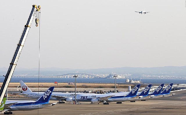 Several All Nippon Airways' Boeing 787 Dreamliners sit on the tarmac at Haneda Airport in Tokyo, Wednesday, Jan. 30, 2013. U.S. regulators said Wednesday they asked Boeing Co. to provide a full operating history of lithium-ion batteries used in its grounded 787 Dreamliners after Japan's All Nippon Airways revealed it had repeatedly replaced the batteries even before overheating problems surfaced. (AP Photo/Shizuo Kambayashi)