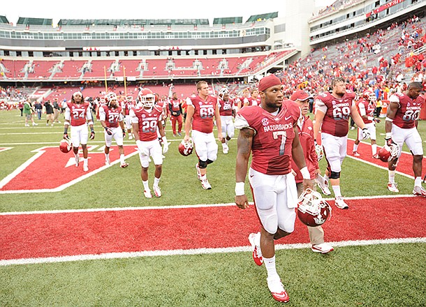 STAFF PHOTO ANDY SHUPE -- Arkansas running back Knile Davis (7) walks off the field after the Razorbacks' 52-0 loss to Alabama Saturday, Sept. 15, 2012, at Razorback Stadium in Fayetteville.