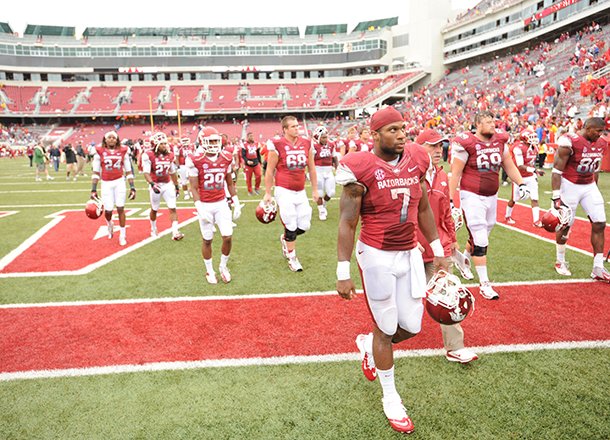 STAFF PHOTO ANDY SHUPE -- Arkansas running back Knile Davis (7) walks off the field after the Razorbacks' 52-0 loss to Alabama Saturday, Sept. 15, 2012, at Razorback Stadium in Fayetteville.