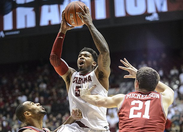 Alabama guard Trevor Lacey (5) takes a leaping shot during an NCAA college basketball game against Arkansas, Thursday, Jan. 31, 2013, in Tuscaloosa, Ala. Alabama won 59-56. (AP Photo/Alabama Media Group, Vasha Hunt) 