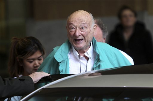 In this Dec. 10, 2012 file photo, former New York City Mayor Ed Koch says good-bye to reporters as he gets in his car after being released from the hospital in New York. A spokesman says Koch now expects to get out of the hospital on Saturday, Jan. 26, 2013. Spokesman George Arzt said Friday that Koch originally expected to remain over the weekend at NewYork-Presbyterian/Columbia hospital. But doctors changed their minds and decided to let him out Saturday instead. He was admitted last Saturday night with fluid in his lungs and swollen ankles. Doctors have told the 88-year-old ex-mayor to limit his salt intake.