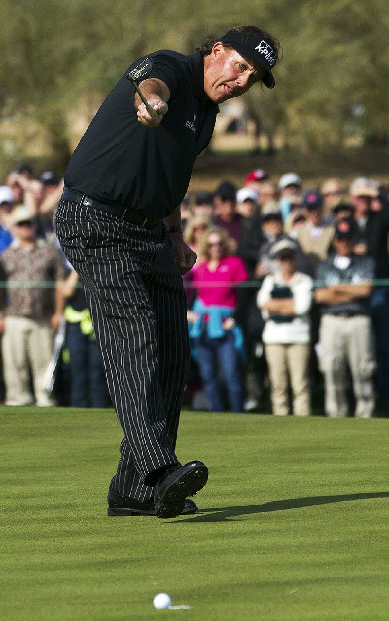 Phil Mickelson watches a putt on the ninth green lip out of the cup Thursday at the Phoenix Open in Scottsdale, Ariz. Had he made it, the putt would have given Mickelson a 59. 