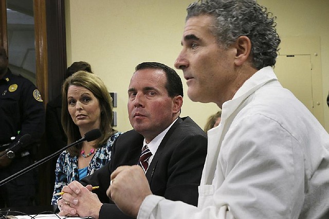 Dr. Emidio Novembre (right) speaks Thursday to the House Committee on Public Health, Welfare and Labor at the Capitol in Little Rock. The committee passed anti-abortion legislation sponsored by Rep. Andy Mayberry (center) and his wife, Julie Mayberry.

