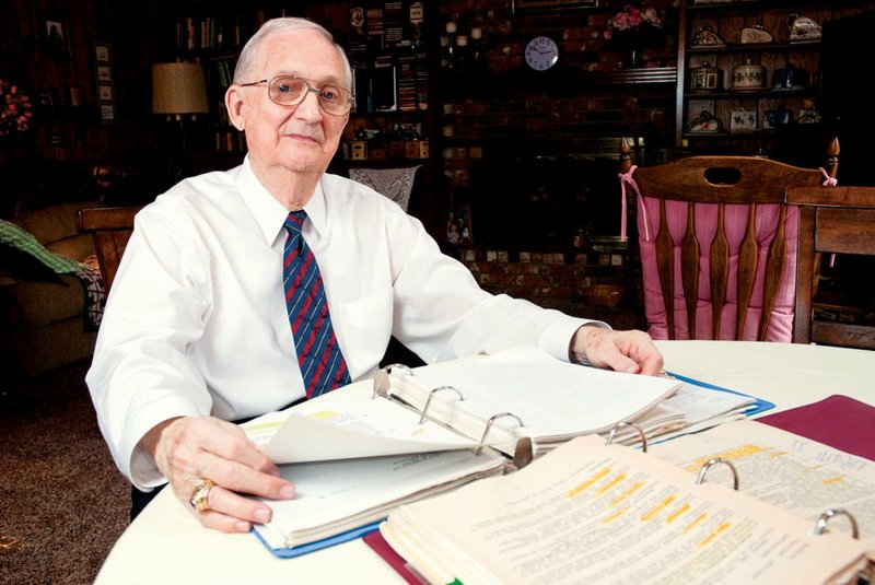 Kenneth R. Brown, 83, has been chosen as the Outstanding Alumnus for Central Baptist College’s homecoming, Feb. 15-16. He taught at CBC for 40 years. Here, he is looking over some of his teaching notes he used for class.