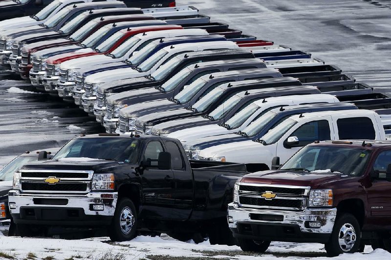 Chevrolet pickups line the lot of a dealership in Murrysville, Pa., last month. General Motors, Ford and Chrysler all reported double-digit sales gains in January. 