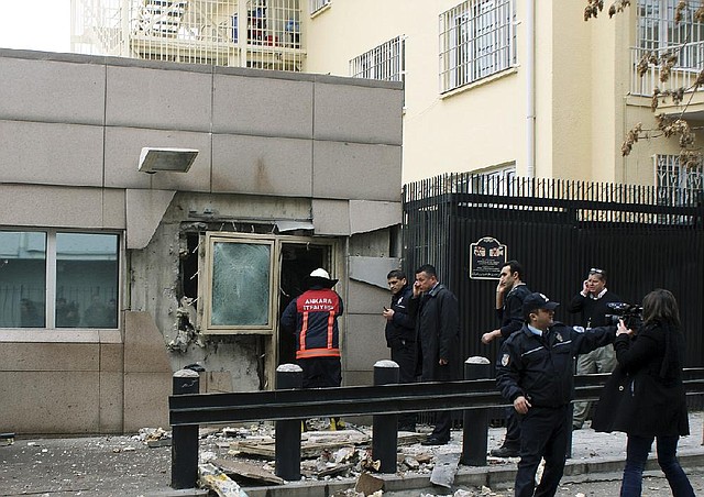 Officials gather at a checkpoint entry to the U.S. Embassy in the Turkish capital, Ankara, on Friday just after a suicide bomber detonated an explosive device. 