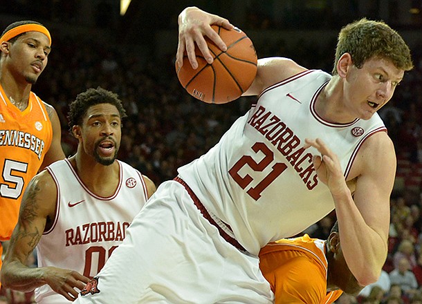 NWA Media/MICHAEL WOODS --02/02/2013-- Arkansas forward Hunter Mickelson pulls in a rebound during the first half of Saturday afternoon's game against Tennessee at Bud Walton Arena in Fayetteville.