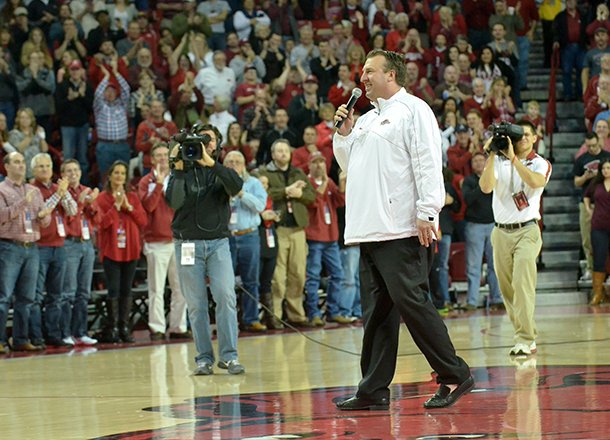 NWA Media/MICHAEL WOODS --02/02/2013-- University of Arkansas football coach Bret Bielema addresses the Razorbacks basketball fans during a time out in the first half of Saturday afternoon's game against Tennessee at Bud Walton Arena in Fayetteville.