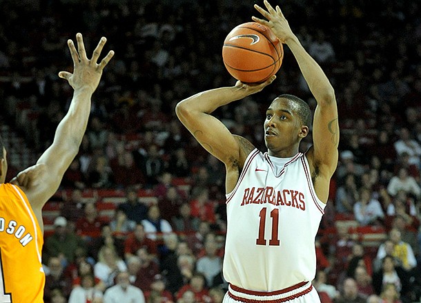 NWA Media/MICHAEL WOODS --02/02/2013-- Arkansas guard BJ Young pulls up for a three-point shot during the second half of Saturday afternoon's game against Tennessee at Bud Walton Arena in Fayetteville.