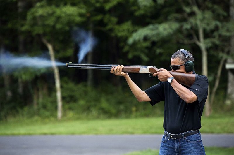 In this photo released by the White House, President Barack Obama shoots clay targets last August on the firing range at Camp David, Md. 