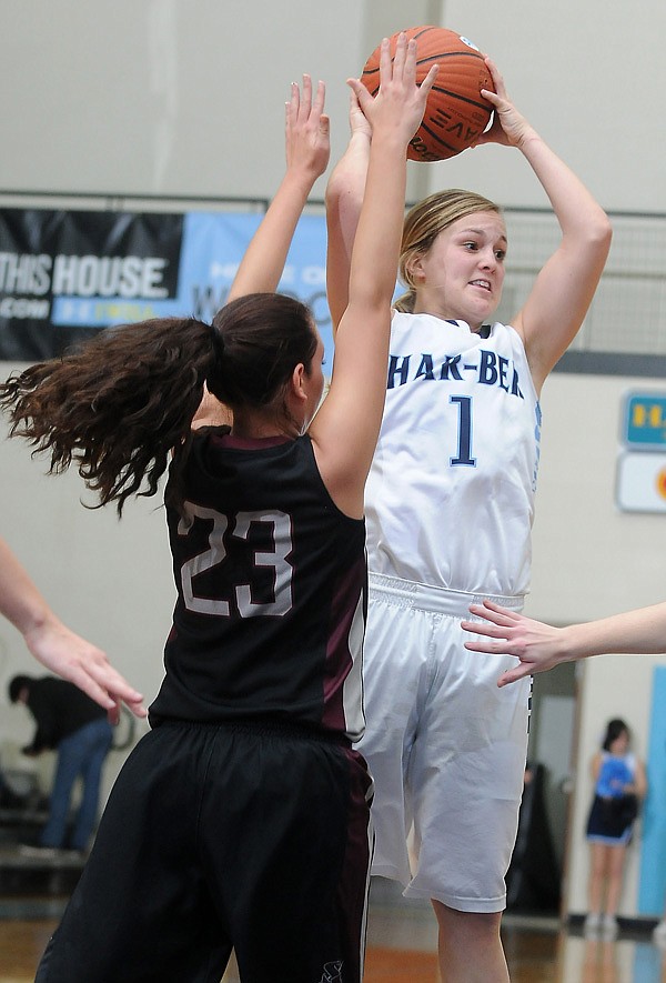 Samantha Weber of Springdale Har-Ber attempts to pass over Siloam Springs’ Krista Lopez on Friday in Springdale. 