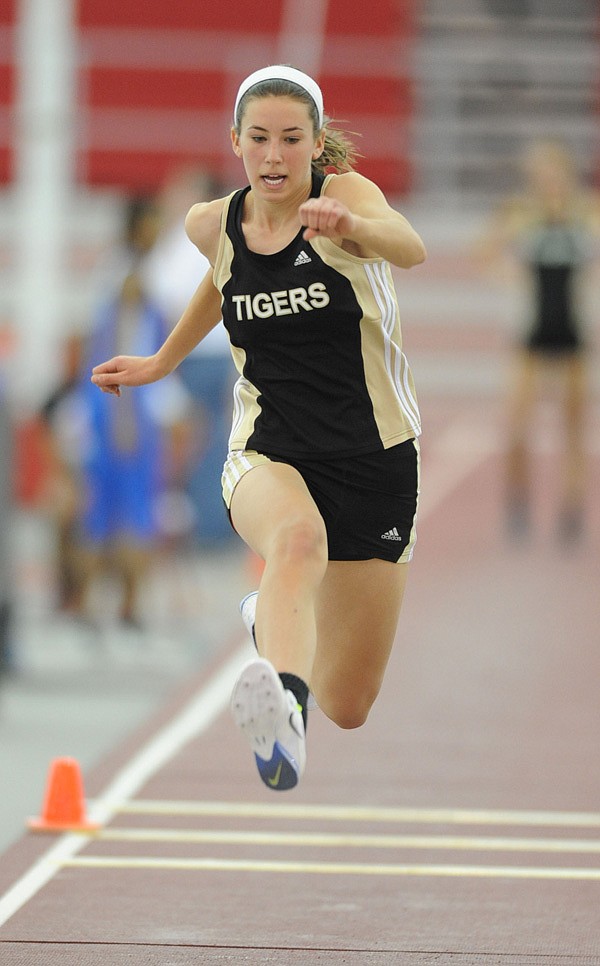 McKenzie Dixon of Bentonville competes in the triple jump Saturday during the state indoor track and field championships at the Randal Tyson Track Center in Fayetteville. 