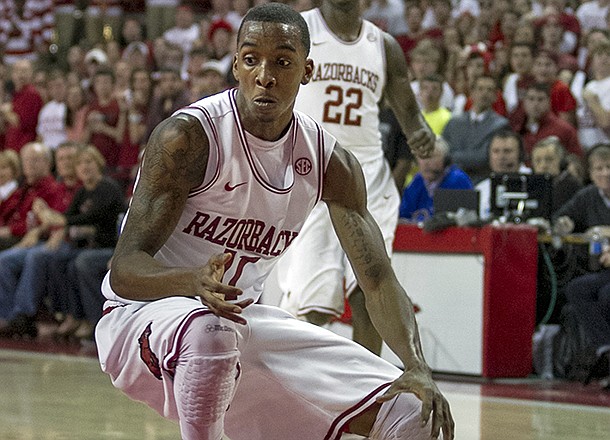 Arkansas' BJ Young (11) prepares to spin to the hoop during the first half an NCAA college basketball game against Tennessee in Fayetteville, Ark., Saturday, Feb. 2, 2013. Arkansas defeated Tennessee 73-60. (AP Photo/Gareth Patterson)