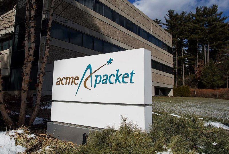 An Acme Packet Inc. sign marks the company’s headquarters in Bedford, Mass. on Monday. 