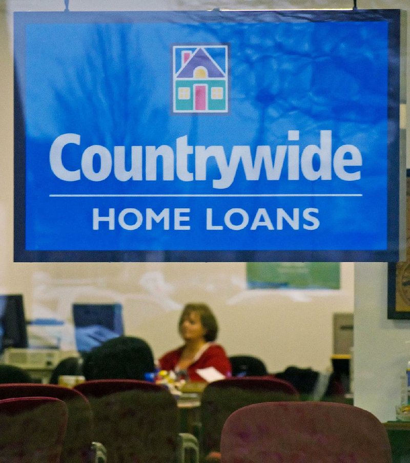 A Countrywide Financial Corp. employee is seen in a loan office in Gahanna, Ohio. Bank of America bought the subprime mortgage giant in 2008. 