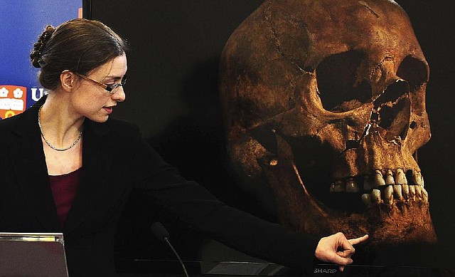 Jo Appleby, a lecturer in human bioarchaeology at the University of Leicester, School of Archaeology and Ancient History, who led the exhumation of the remains found during a dig at a Leicester parking lot, speaks at the university Monday. 