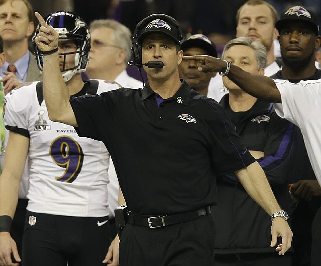Baltimore Ravens Coach John Harbaugh works the sidelines during the first half of Sunday’s game in New Orleans. It marked the first time brothers coached against each other in the Super Bowl. 
