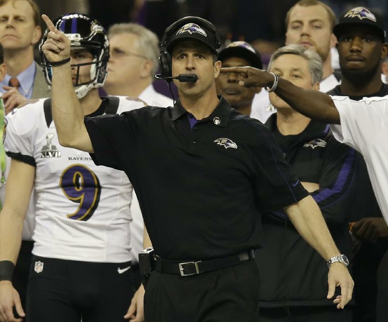 Baltimore Ravens Coach John Harbaugh works the sidelines during the first half of Sunday’s game in New Orleans. It marked the first time brothers coached against each other in the Super Bowl. 