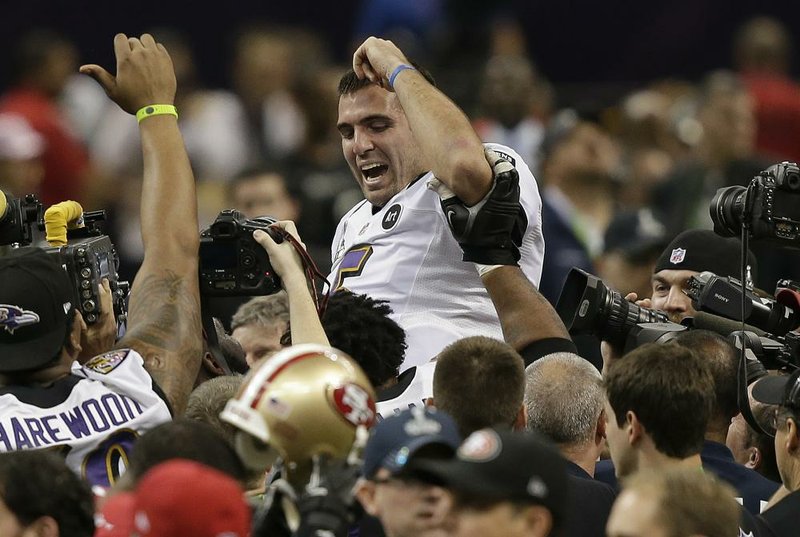 Baltimore Ravens quarterback Joe Flacco is celebrated by his teammates after leading the Ravens to a 34-31 victory over the San Francisco 49ers on Sunday night in New Orleans. Flacco, the game’s MVP, passed for 287 yards and three touchdowns, one of those a 56-yard pass to Jacoby Jones, who also returned the second-half kickoff 108 yards for a touchdown. Flacco’s performance capped a four-game playoff run during which he threw 11 touchdown passes with no interceptions. 
