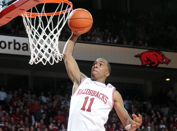 Arkansas' BJ Young dunks the ball in the second half of the game Tuesday, Feb. 5, 2013, against No. 2 Florida at Bud Walton Arena in Fayetteville. Arkansas upset the Gators, 80-69.