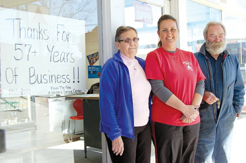 The sale of Walter’s Service Center in downtown Conway was finalized Friday to Phil and Diana Hawks Kirkland. Standing in front of the station are, from the left, former owner Virginia Walter, Dee Ann Walter Davis, who managed the station, and Ed Erbach, a 45-year employee of the business. Started 57 years ago by the late Martin Walter, the business will remain open as it is remodeled to become Central Station convenience store. The Kirklands said they will keep the station’s full-service amenities.