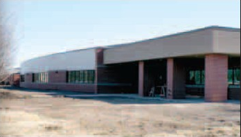 The facade of a new addition to Gravette Middle School appears similar to the old school building it replaces. The entrance/office area is in the same location as before, while a curved front facade adds an attractive contrast to the present middle school which it joins. Also an eye-catching entrance approach is not shown in the photo. 