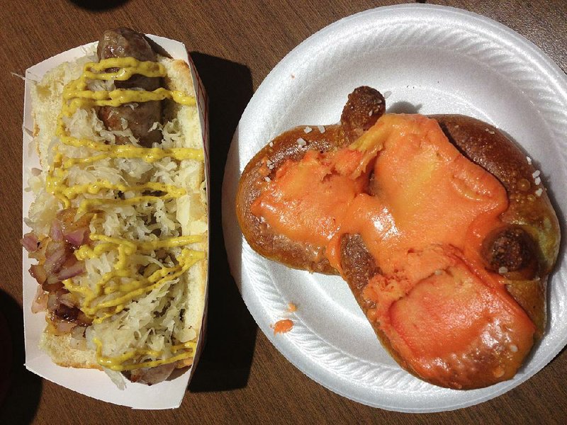  Pretzel with port wine cheese spread and a bratwurst with sauerkraut, grilled onions and mustard at Mr. Dunderbak's.
