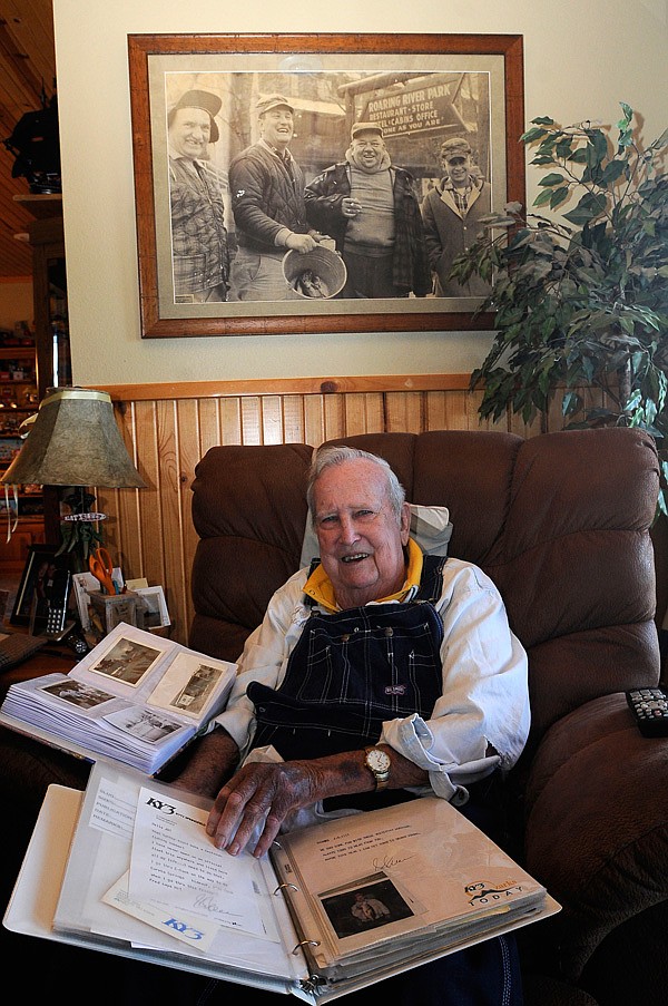 J.D. Fletcher of Eagle Rock, Mo., has 40 to 50 albums of photos, letters and newspaper and magazine articles from his years as a fishing guide on Table Rock Lake and the Kings River. He’s kept every photo he’s taken since the 1950s and has a vast collection of lures and fishing tackle. Here he looks at some of his photos on Feb. 1. The photo above Fletcher’s chair shows Fletcher, second from left, and some of his friends after trout fishing at Roaring River State Park. 