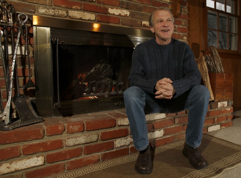 David Adams at his favorite personal space, near the fire place in the family room of his Fayetteville home.
