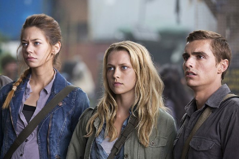 Analeigh Tipton (from left), Teresa Palmer and Dave Franco star in Warm Bodies. The movie came in first at last weekend’s box office and made more than $20 million. 