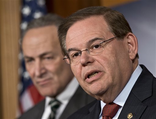 In this Monday, Jan. 28, 2013 file photograph, Sen. Robert Menendez, D-N.J., right, and Sen. Charles Schumer, D-N.Y., left, announce with other senators that they have reached agreement on the principles of sweeping legislation to rewrite the nation's immigration laws, during a news conference at the Capitol in Washington. Menendez said Monday, Feb. 4, 2013, that allegations that he engaged with prostitutes in the Dominican Republic are false "smears." He said he has done nothing wrong and that allegations otherwise are "totally unsubstantiated." 