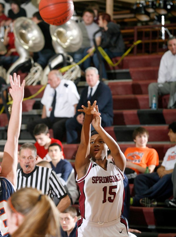 Javonda Daniels, Springdale High sophomore, attempts a 3-pointer Tuesday against Rogers Heritage in Springdale. 