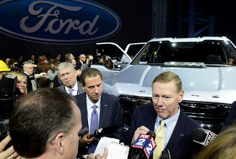 Alan Mulally, president and chief executive officer of Ford Motor Co., speaks to the media after the unveiling of the F-150 Atlas concept truck during the 2013 North American International Auto Show (NAIAS) in Detroit, Michigan, U.S., on Tuesday, Jan. 15, 2013. Ford Motor Co., trying to fend off new pickups from competitors targeting its top-selling F-Series, showed an F-150 prototype with features that boost fuel economy and foreshadow its future for the segment. Photographer: David Paul Morris/Bloomberg *** Local Caption *** Alan Mulally