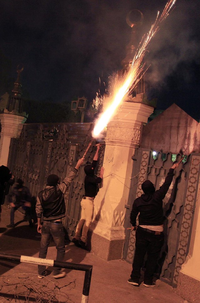 Egyptian protesters set off fireworks Friday at the presidential palace during a demonstration in Cairo. 