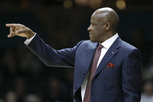 Arkansas head coach Mike Anderson motions to his players in the first half of an NCAA college basketball game against Vanderbilt on Saturday, Feb. 9, 2013, in Nashville, Tenn. (AP Photo/Mark Humphrey)