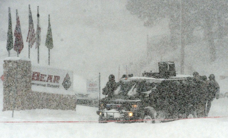 A San Bernardino County Sheriff SWAT team returns to the command post at Bear Mountain near Big Bear Lake, Calif. after searching for Christopher Jordan Dorner on Friday, Feb. 8, 2013. Search conditions have been hampered by a heavy winter storm in the area. Dorner, a former Los Angeles police officer, is accused of carrying out a killing spree because he felt he was unfairly fired from his job.