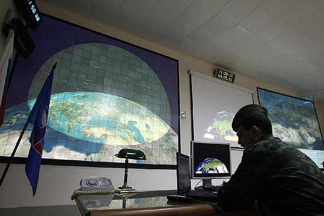 FILE - In this  Friday, May 4, 2012 file photo, a Russian military officer is on duty in the main control center of a radar station at the missile defense facility in Sofrino, 50 km (31 miles) northeast of Moscow. Secret U.S. Defense Department studies have cast doubt on whether a multibillion dollar missile defense system planned for Europe will ever be able to protect the United States from Iranian missiles as intended, congressional investigators say. (AP Photo/Mikhail Metzel, File)