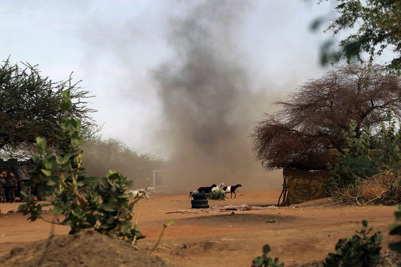 French soldiers detonate three grenades in a controlled explosion in the area where a suicide bomber exploded at the entrance of Gao, northern Mali, Sunday Feb. 10, 2013. It was the second time a suicide bomber targeted the Malian army checkpoint in three days.