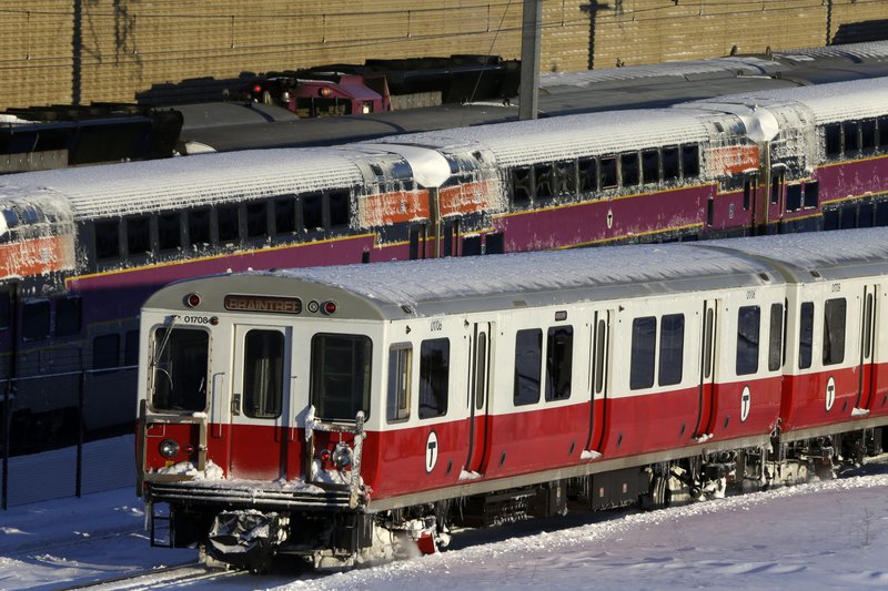 Massachusetts Bay Transportation Authority commuter trains wait to start running again early Sunday, Feb. 10, 2013 in Boston. The MBTA hopes to have commuter train service fully restored for the Monday morning rush hour.